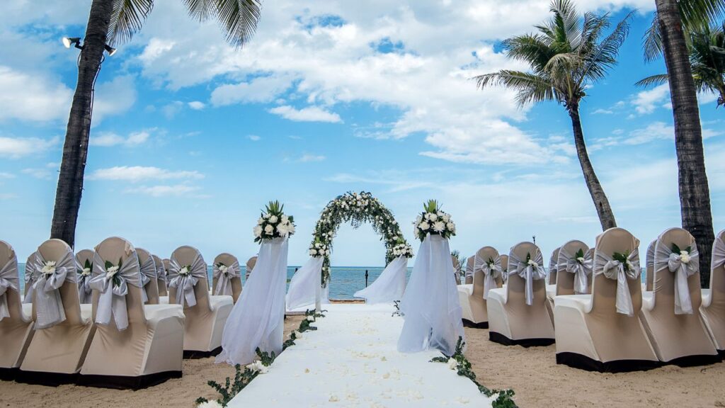 Seats and an alter on a tropical beach.